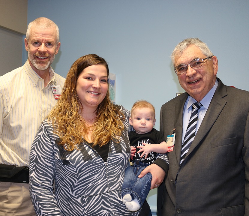 Photo of pediatric cardiologist Dr. John Caton, Jessica, Baby Ryker, and pediatric cardiologist Dr. James Prochazka